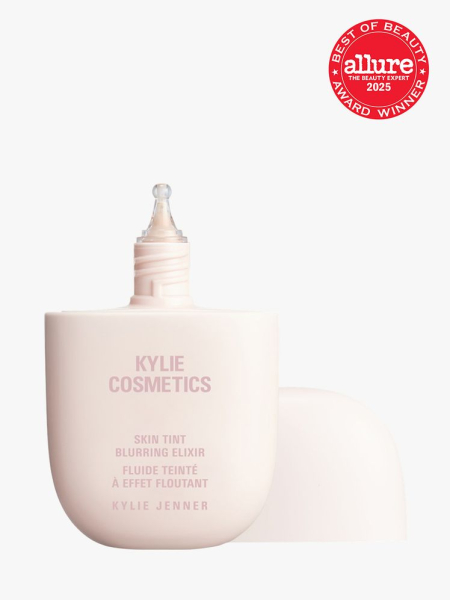 Kylie Cosmetics Skin Tint Blurring Elixir in branded soft pink bottle with cap on light gray background with red Allure Best of Beauty seal in the top right corner